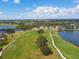 Aerial view of the community golf course featuring lush green fairways and ponds at 1415 Millbrook Cir, Bradenton, FL 34212