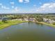 Expansive aerial shot of the community lake, golf course, and surrounding homes at 1415 Millbrook Cir, Bradenton, FL 34212