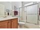 Bright bathroom features a vanity with a tub and shower combination at 1415 Millbrook Cir, Bradenton, FL 34212