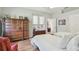 Comfortable bedroom featuring hardwood floors, a ceiling fan, closet and outside access at 1415 Millbrook Cir, Bradenton, FL 34212
