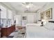 Bright and spacious bedroom featuring two beds, hardwood floors, and ample natural light at 1415 Millbrook Cir, Bradenton, FL 34212