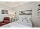 Bright bedroom with a full bed, hard floors and a comfortable leather recliner at 1415 Millbrook Cir, Bradenton, FL 34212