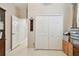 Spacious closet with white doors and a glimpse into an adjoining room at 1415 Millbrook Cir, Bradenton, FL 34212