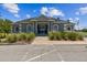 Exterior front view of the community clubhouse with well-maintained landscaping and inviting entrance at 1415 Millbrook Cir, Bradenton, FL 34212