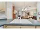 A modern kitchen sink area looks out to a nicely furnished living space at 1415 Millbrook Cir, Bradenton, FL 34212
