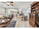 Bright kitchen with stainless steel appliances, bar seating, and cabinetry with a view of the living space at 1415 Millbrook Cir, Bradenton, FL 34212