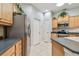 Bright kitchen featuring stainless steel appliances, eat-in area, and ample cabinet space at 1415 Millbrook Cir, Bradenton, FL 34212