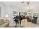 Open living area with piano, comfortable seating, and view into dining room at 1415 Millbrook Cir, Bradenton, FL 34212