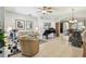 Spacious living area featuring tile floors, a piano, and neutral-toned furniture at 1415 Millbrook Cir, Bradenton, FL 34212