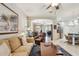 An open layout with comfortable seating connects the living room to the kitchen and dining area at 1415 Millbrook Cir, Bradenton, FL 34212