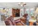 Bright living room with built-in entertainment center and comfortable seating at 1415 Millbrook Cir, Bradenton, FL 34212