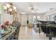 Open-concept living space with elegant dining area and a grand piano at 1415 Millbrook Cir, Bradenton, FL 34212