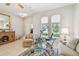 Bright living room with large windows, exercise machine, and neutral decor at 1415 Millbrook Cir, Bradenton, FL 34212