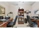 Functional office space with two desks, chairs, and storage at 1415 Millbrook Cir, Bradenton, FL 34212