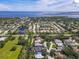 An aerial shot of the property surrounded by lush green vegetation, serene ponds and mature landscaping at 1508 86Th Nw Ct, Bradenton, FL 34209