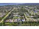 Aerial view shows the property surrounded by lush green trees and mature landscaping in an established neighborhood at 1508 86Th Nw Ct, Bradenton, FL 34209