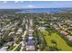 High aerial showcasing this home in a vibrant, verdant community with lake views and mature trees at 1508 86Th Nw Ct, Bradenton, FL 34209