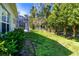 Lush backyard with privacy and mature landscaping, including a screened in lanai for outdoor enjoyment at 1508 86Th Nw Ct, Bradenton, FL 34209