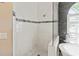 Sleek and modern bathroom with a glass shower, white tile and black accent at 1508 86Th Nw Ct, Bradenton, FL 34209