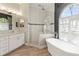 Stylish bathroom with marble vanity, soaking tub, and updated lighting at 1508 86Th Nw Ct, Bradenton, FL 34209