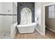 Luxurious bathroom featuring a soaking tub, walk-in shower, and modern finishes at 1508 86Th Nw Ct, Bradenton, FL 34209