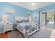 Light-filled bedroom with access to the pool and patio area at 1508 86Th Nw Ct, Bradenton, FL 34209