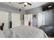 Spacious bedroom featuring hardwood floors, ceiling fan, and a neutral color scheme at 1508 86Th Nw Ct, Bradenton, FL 34209