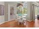 Cozy breakfast nook with view of screened-in pool area and outdoor kitchen at 1508 86Th Nw Ct, Bradenton, FL 34209
