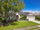 Lovely single-story home with lush green lawn, mature shade trees, and well-maintained landscaping at 1508 86Th Nw Ct, Bradenton, FL 34209