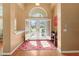 Inviting foyer with natural light, a decorative rug, and a view of the front yard through the open doors at 1508 86Th Nw Ct, Bradenton, FL 34209