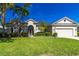 Charming single-story home with a well-manicured lawn, mature landscaping, and a spacious two-car garage at 1508 86Th Nw Ct, Bradenton, FL 34209