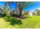 Well maintained lawn and tropical trees framing this home's curb appeal at 1508 86Th Nw Ct, Bradenton, FL 34209