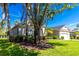 Landscaped front yard with a well-maintained lawn and mature trees enhancing this home's curb appeal at 1508 86Th Nw Ct, Bradenton, FL 34209