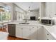 Modern kitchen with stainless steel appliances and a view of the outdoor living area at 1508 86Th Nw Ct, Bradenton, FL 34209