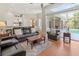 Open concept living room showcases access to kitchen, eat-in-kitchen, and screened-in lanai at 1508 86Th Nw Ct, Bradenton, FL 34209