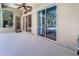 Covered patio with a view of pool and backyard, featuring large windows and sliding glass doors to the interior at 1508 86Th Nw Ct, Bradenton, FL 34209