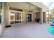 Outdoor patio with pool, outdoor grill and interior view through large sliding glass doors at 1508 86Th Nw Ct, Bradenton, FL 34209