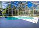 Inviting screened-in pool featuring clear blue water and a spacious deck, creating a serene outdoor retreat at 1508 86Th Nw Ct, Bradenton, FL 34209