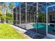Screened-in pool with an adjacent patio, providing a private and inviting outdoor space with lush landscaping at 1508 86Th Nw Ct, Bradenton, FL 34209
