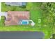Aerial view showcasing a private pool, putting green, patio, and meticulously manicured backyard at 16038 39Th E Gln, Parrish, FL 34219