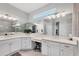 Bright bathroom featuring double sinks, quartz countertops, and a large mirror to allow natural light at 16038 39Th E Gln, Parrish, FL 34219