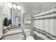 The modern bathroom is light and bright and includes a shower and neutral tones at 16038 39Th E Gln, Parrish, FL 34219