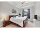 Comfortable bedroom with tray ceilings, a ceiling fan, and a large window to allow natural light at 16038 39Th E Gln, Parrish, FL 34219