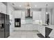 Modern kitchen with white cabinets, stainless steel appliances, and updated fixtures, offering style and functionality at 16038 39Th E Gln, Parrish, FL 34219