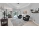 Living room area features modern lighting, sliding glass doors to patio, tile floors and neutral walls at 16038 39Th E Gln, Parrish, FL 34219