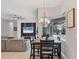 Open floor plan showcases a dining area and a living room that overlooks the screened-in lanai and pool at 16038 39Th E Gln, Parrish, FL 34219