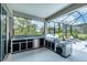 This fabulous outdoor kitchen is complete with a built-in grill, sink, and stainless steel mini-fridge at 16038 39Th E Gln, Parrish, FL 34219