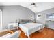 Well-lit bedroom with a vaulted ceiling, complemented by hardwood floors and stylish furniture at 200 Cocoanut Ave # 1, Sarasota, FL 34236