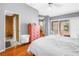 Spacious bedroom with a door to the bathroom and balcony access, featuring a walk-in closet at 200 Cocoanut Ave # 1, Sarasota, FL 34236