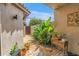 Secluded courtyard with brick pavers, tropical plants, and serene garden walls for a tranquil outdoor retreat at 200 Cocoanut Ave # 1, Sarasota, FL 34236